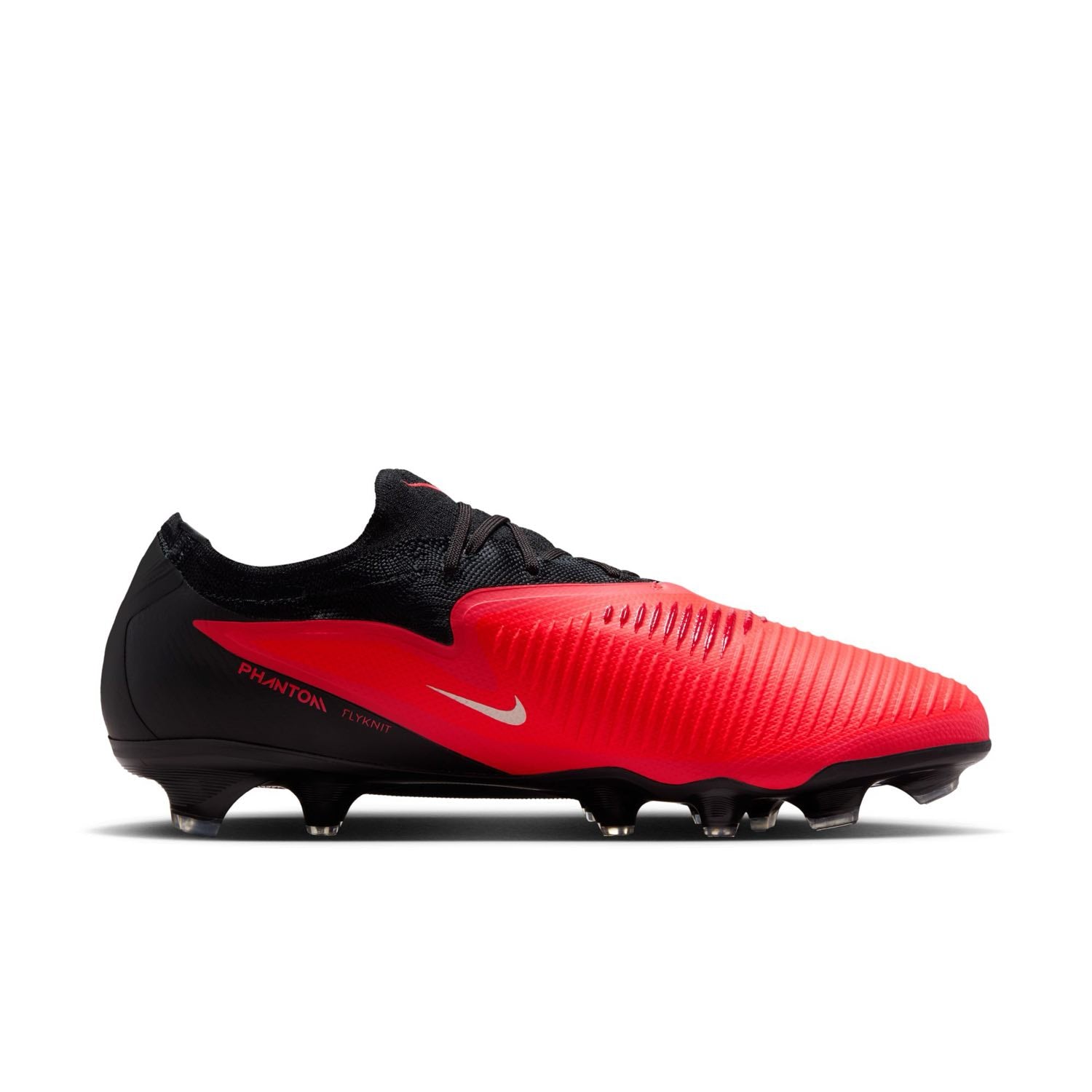 Nike Phantom 6 Low Pro FG red and black firm-ground soccer cleats with VNMSkin upper and Cyclone 360 traction plate.