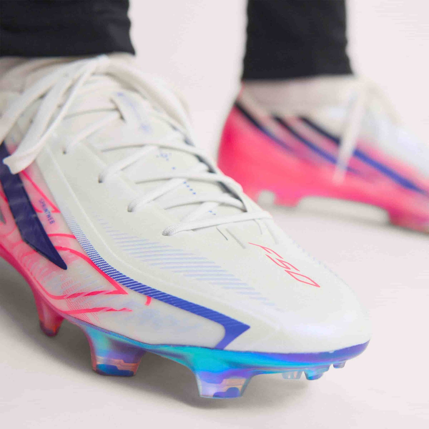 adidas F50 Hyperfast Elite FG soccer cleat in silver, navy and pink with firm-ground outsole